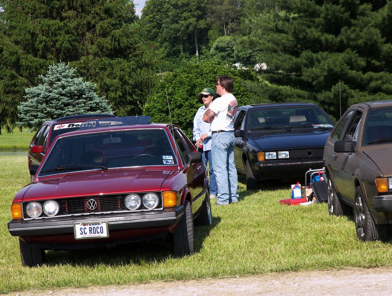 Chucks car, John ex-caddy, and Kim